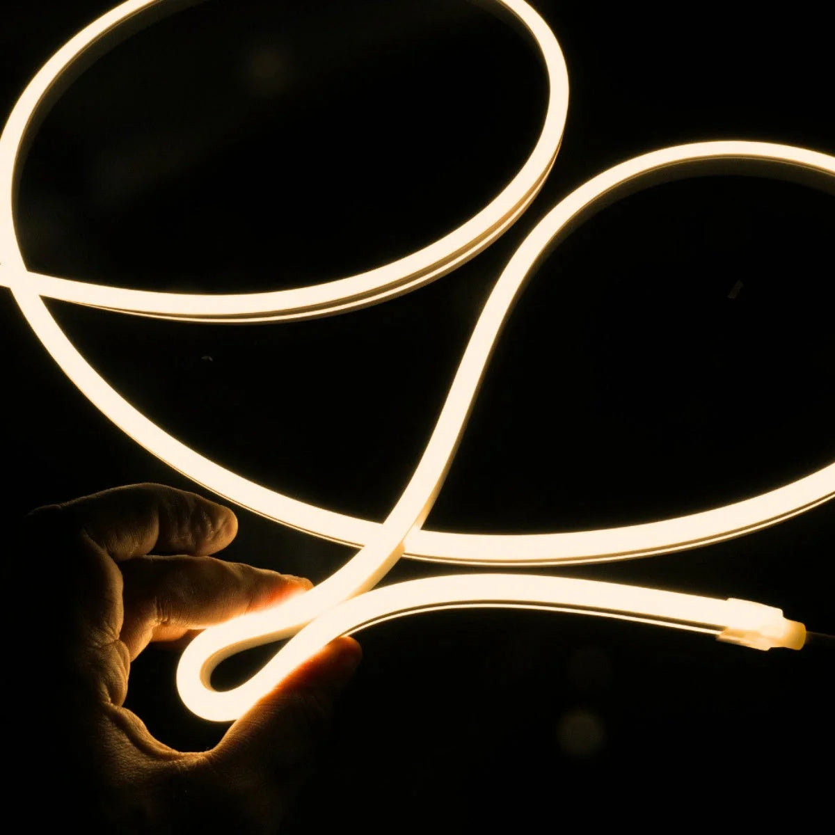 ATOM LED warm white 3000K 10x10mm side bend neon flex bending flat around an outdoor flower border — 48V IP67 waterproof
