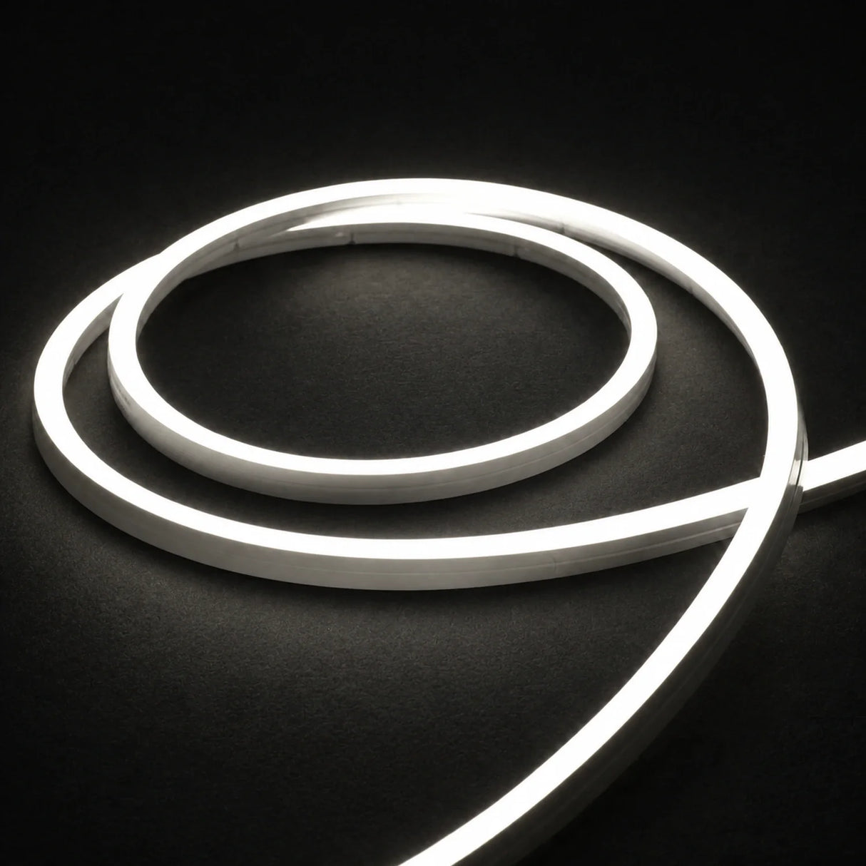 4000K side-bend Neon Flex coiled on a dark surface, colour-adjusted product photograph