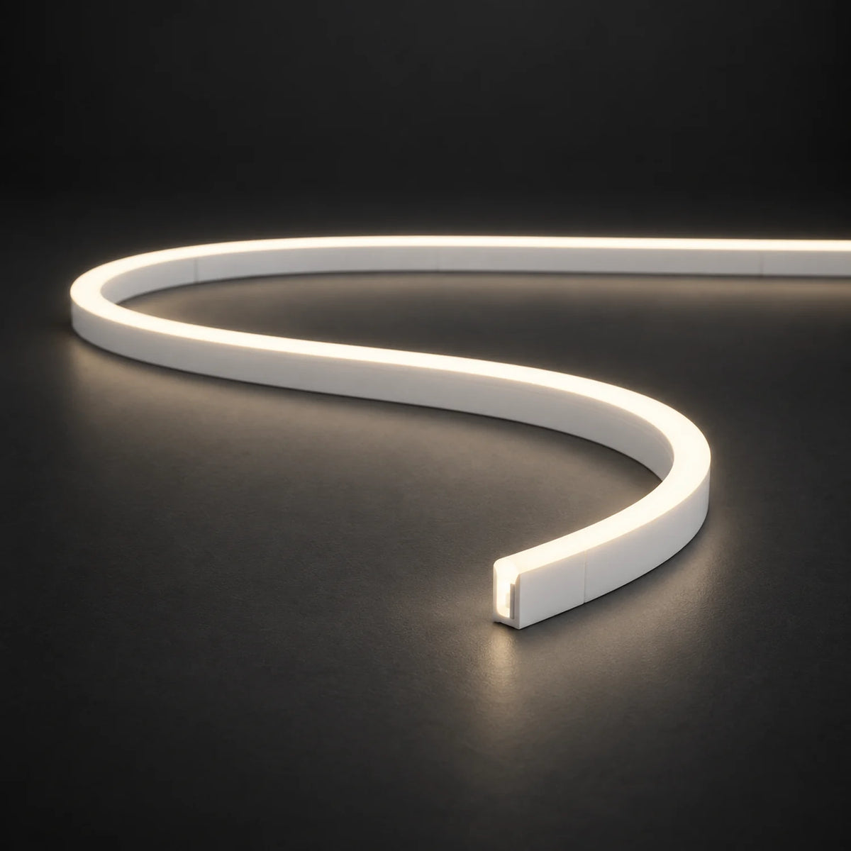 Natural White 4000K 6x12mm 12V IP65 LED neon flex with a domed luminous top in an S-curve on dark charcoal.
