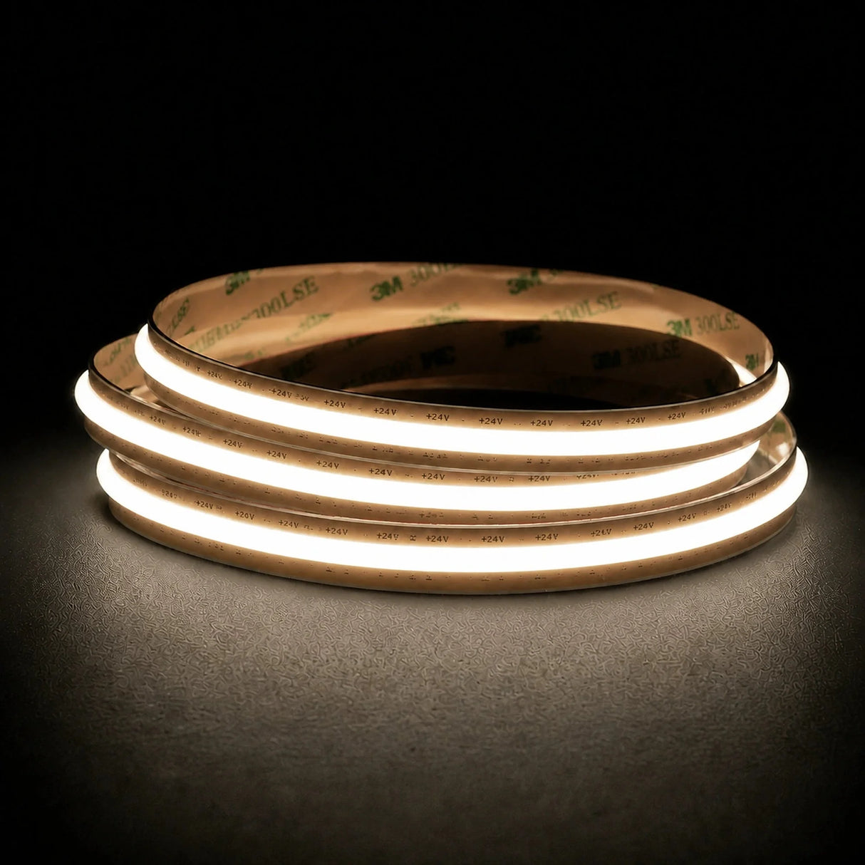 Natural White 4000K Free Cut COB LED strip coil illuminated on a dark background, 24V DC and 10mm wide.