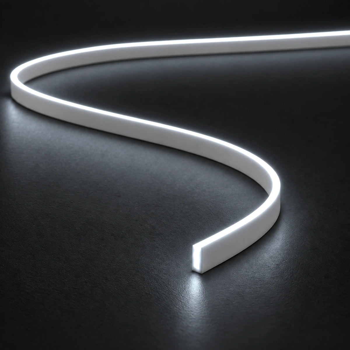 UK LED Lights FreeCut Mini Neon Flex 4x6mm 6000K cool white illuminated S-shaped strip on charcoal surface