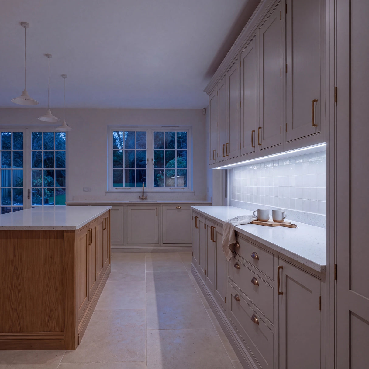 Cool White 6500K Free Cut COB LED strip lighting beneath wall cabinets in a large British kitchen in the evening; installation illustration.