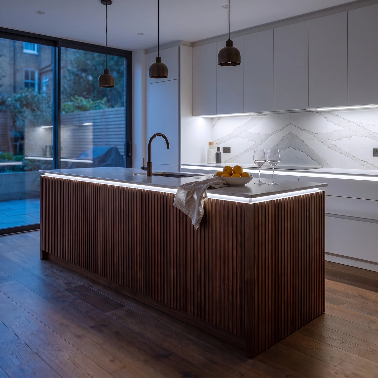 Cool White 6500K 24V 10mm SCOB LED strip installed beneath cabinets and around a British kitchen island; installation visual.