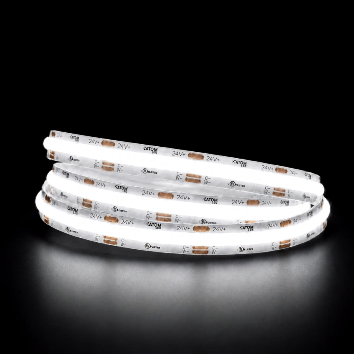 Daylight 5000K COB LED strip illuminated in a coil against a black background