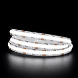 Daylight 5000K COB LED strip illuminated in a coil against a black background