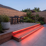 Red 15x15mm Top Bend LED neon flex - outdoor timber decking installation illustration.