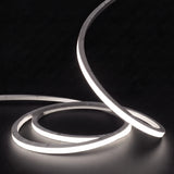 Neutral White 4000K LED Neon Flex 15x15mm Top Bend, low concentric coils with raised arc and colour glow on a black surface