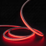 Red LED Neon Flex 15x15mm Top Bend, low concentric coils with raised arc and colour glow on a black surface