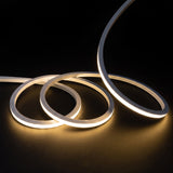 Warm White 2700K LED Neon Flex 15x15mm Top Bend, overlapping offset coils with raised arc and colour glow on a black surface