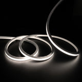 Neutral White 4000K LED Neon Flex 15x15mm Top Bend, overlapping offset coils with raised arc and colour glow on a black surface