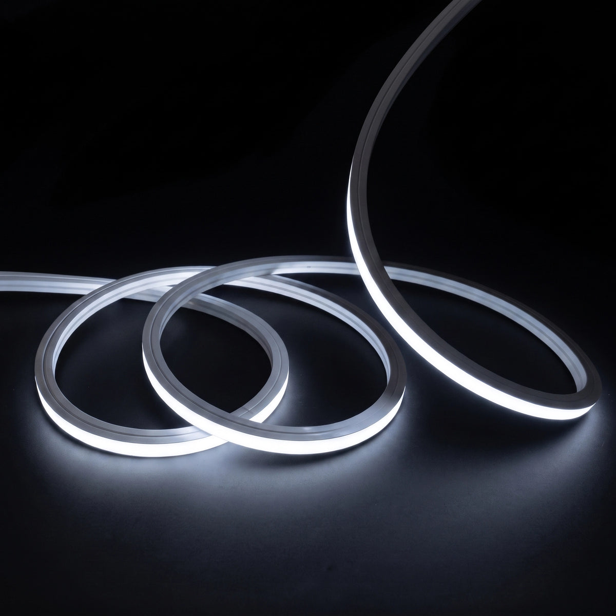 Cool White 6000K LED Neon Flex 15x15mm Top Bend, overlapping offset coils with raised arc and colour glow on a black surface