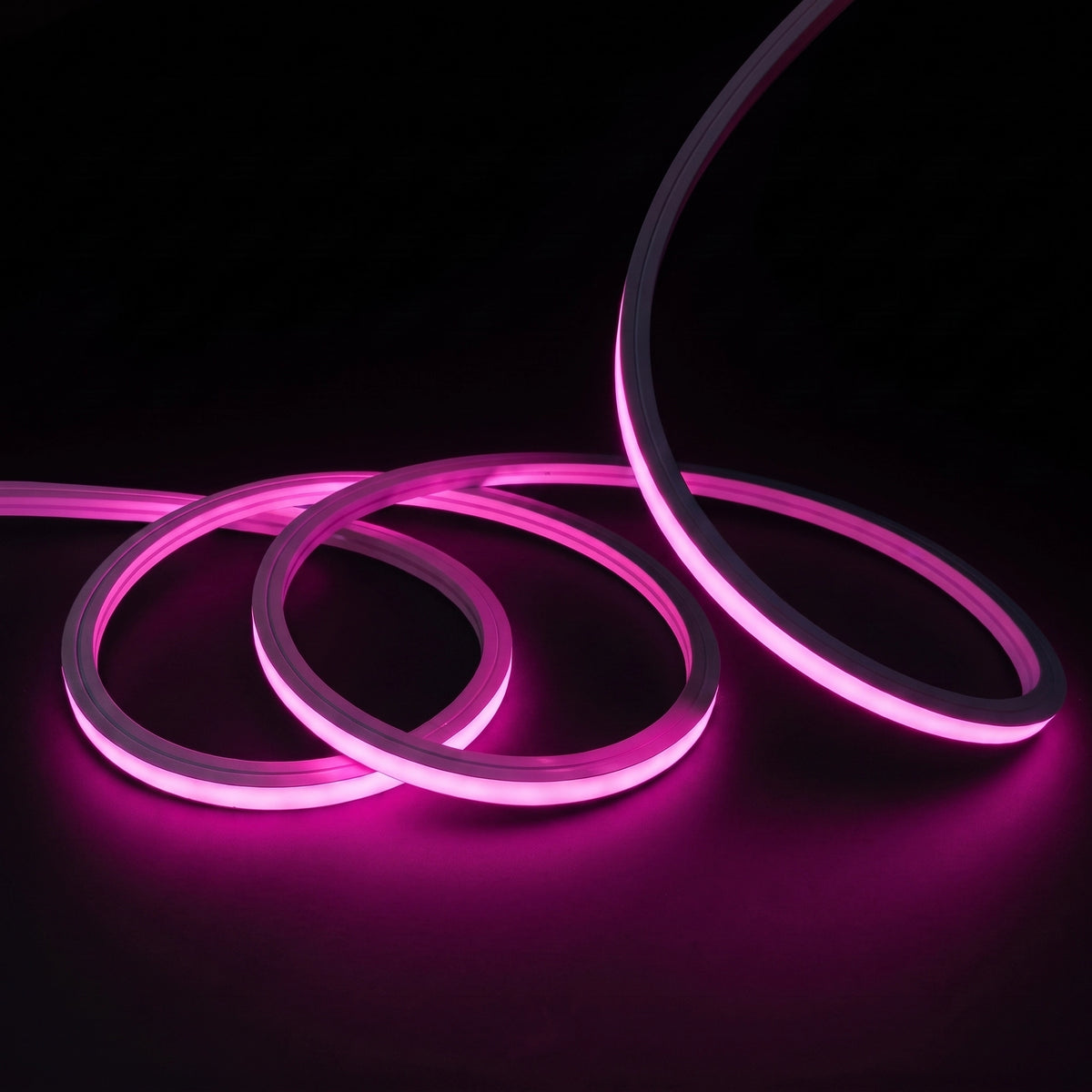 Pink LED Neon Flex 15x15mm Top Bend, overlapping offset coils with raised arc and colour glow on a black surface