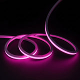 Pink LED Neon Flex 15x15mm Top Bend, overlapping offset coils with raised arc and colour glow on a black surface