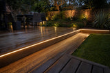 ATOM LED cool white 6000K 10x10mm side bend neon flex wrapping a curved outdoor garden border — 48V IP67 waterproof