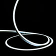ATOM LED cool white 6000K 10x10mm side bend neon flex turning a 90° corner around an outdoor garden patio — 48V IP67 waterproof