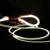 ATOM LED natural white 4000K 10x10mm side bend neon flex lighting a driveway edge in one continuous run — 48V IP67 waterproof