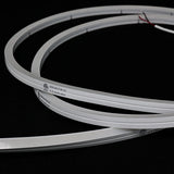 ATOM LED natural white 4000K 10x10mm side bend neon flex running along an outdoor step edge at dusk — 48V IP67 waterproof