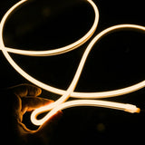 ATOM LED warm white 2700K 10x10mm side bend neon flex bending flat around an outdoor flower border — 48V IP67 waterproof