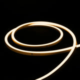 ATOM LED warm white 2700K 10x10mm side bend neon flex outlining a pergola frame outdoors — 48V IP67 waterproof