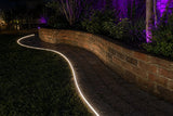 ATOM LED warm white 3000K 10x10mm side bend neon flex wrapping a curved outdoor garden border — 48V IP67 waterproof
