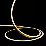 ATOM LED warm white 3000K 10x10mm side bend neon flex turning a 90° corner around an outdoor garden patio — 48V IP67 waterproof