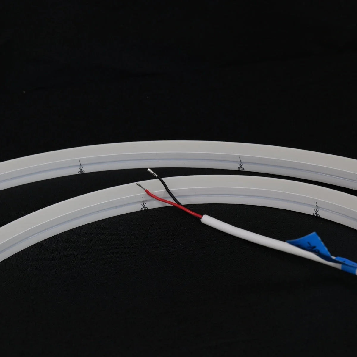 ATOM LED warm white 3000K 10x10mm side bend neon flex forming a square 90° corner along a garden path — 48V IP67 waterproof