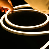 ATOM LED warm white 3000K 10x10mm side bend neon flex fitted flat along timber decking — 48V IP67 waterproof