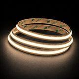 3000K Free Cut COB LED strip 24V 8mm IP20 illuminated coil on black background