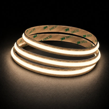 3000K Free Cut COB LED strip 24V 8mm IP20 illuminated coil on black background