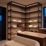 3000k white dot-free LED strip lighting beneath dark-walnut display shelves in a residential dressing room
