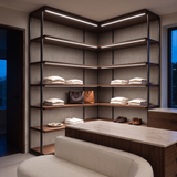 5000k white dot-free LED strip lighting beneath dark-walnut display shelves in a residential dressing room