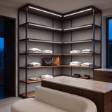 6500k white dot-free LED strip lighting beneath dark-walnut display shelves in a residential dressing room