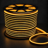 8×16mm 220–240V golden yellow IP65 neon flex lit reel on dark charcoal background