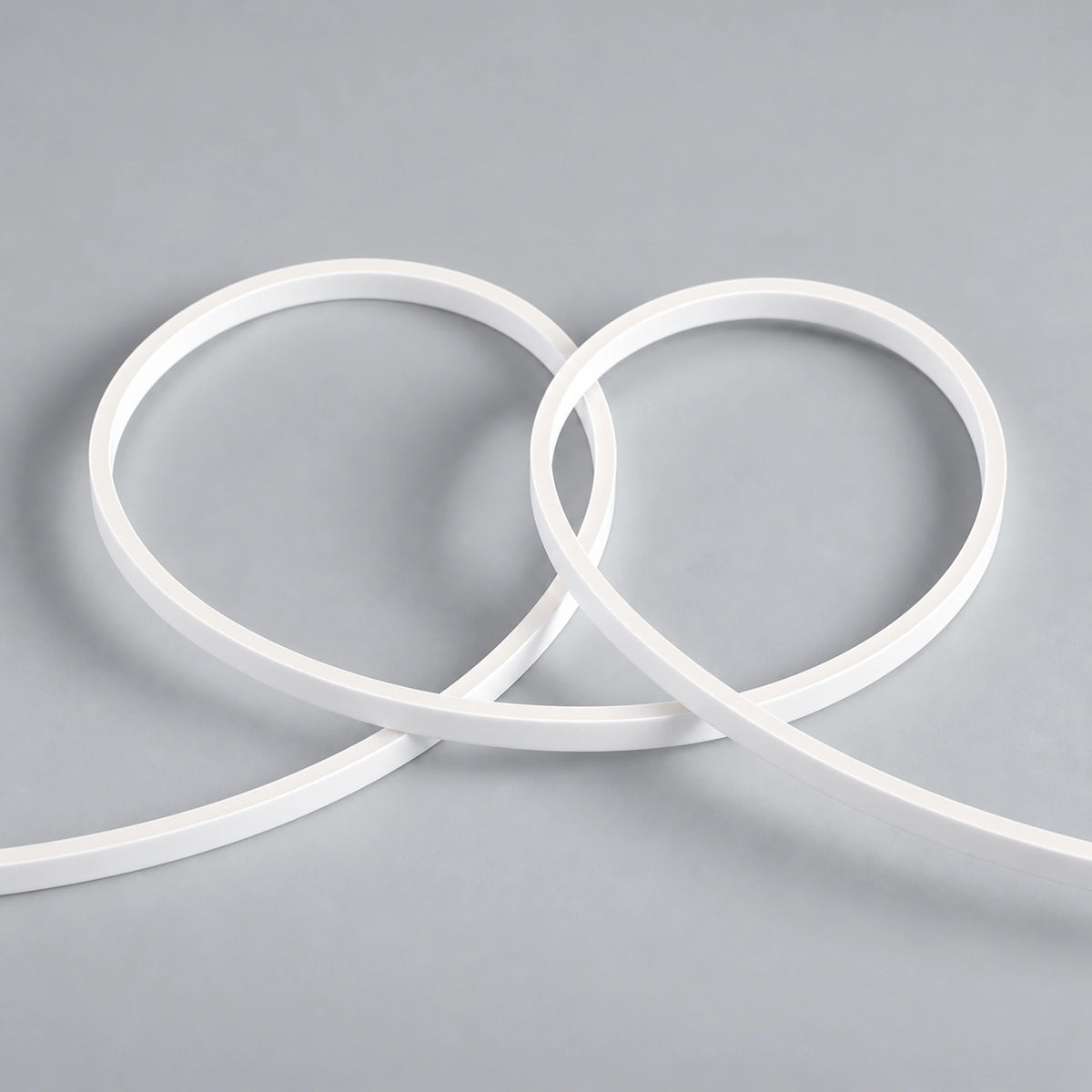 UK LED Lights — FreeCut mini neon flex 4x8mm unlit white silicone LED strip showing flexible loops