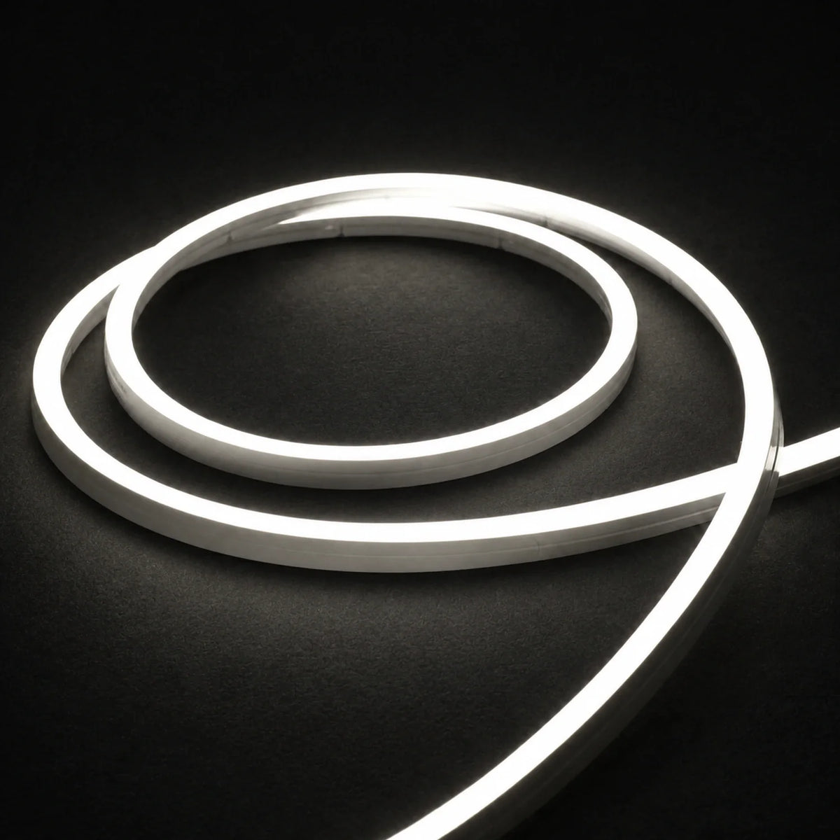4000K side-bend Neon Flex coiled on a dark surface, colour-adjusted product photograph
