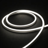 4000K side-bend Neon Flex coiled on a dark surface, colour-adjusted product photograph