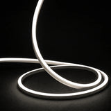 4000K side-bend Neon Flex raised in loops on a dark surface, colour-adjusted product photograph