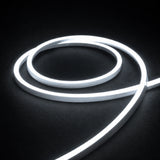 6000K side-bend Neon Flex coiled on a dark surface, colour-adjusted product photograph