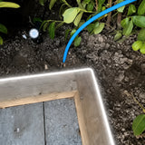 6000K side-bend Neon Flex outlining a timber garden edge, colour-adjusted installation illustration