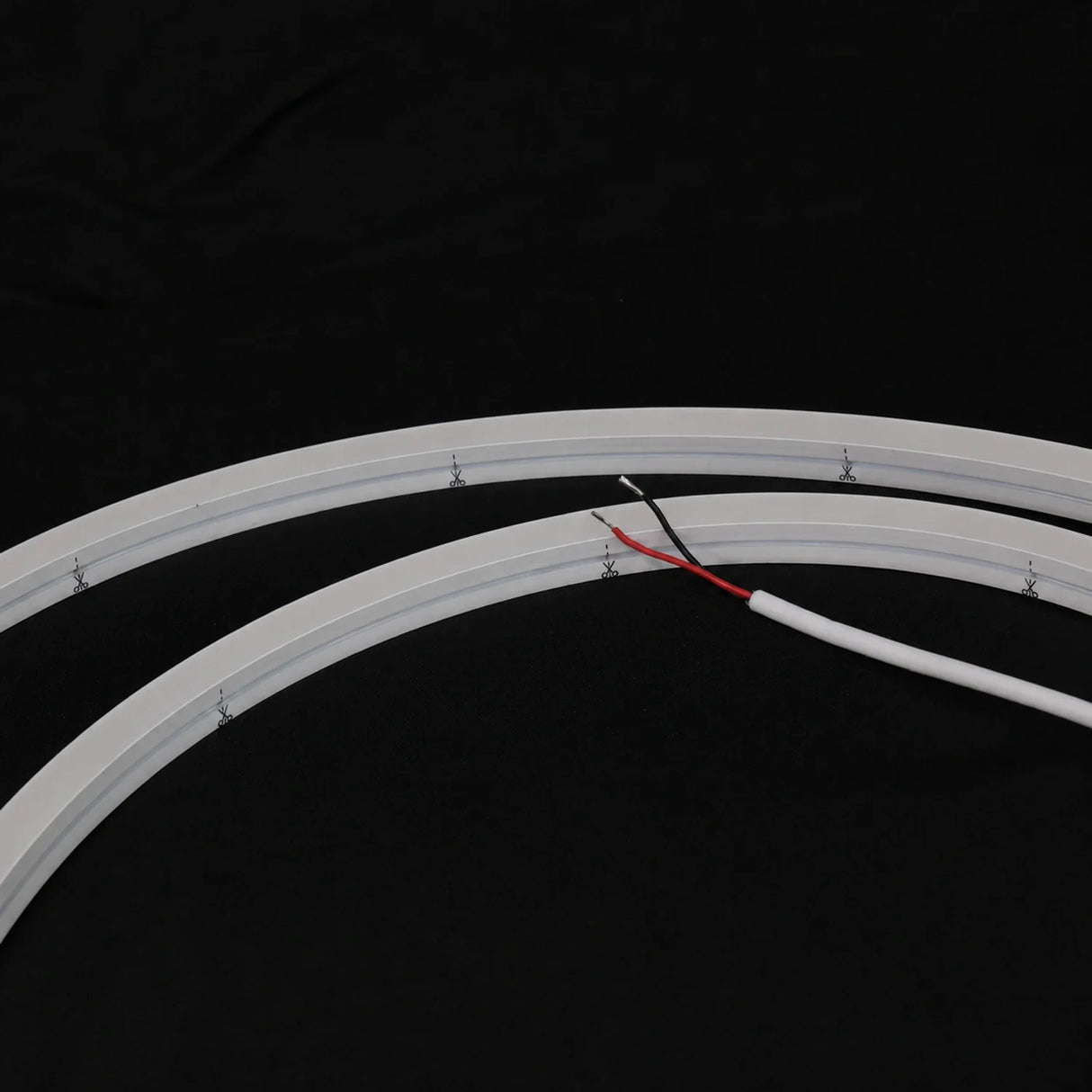 Unlit 15×15mm side-bend Neon Flex showing cut marks and two-wire lead