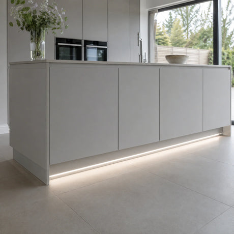 4000K 10×6mm Neon Flex lighting a kitchen plinth and kickboard, installation illustration