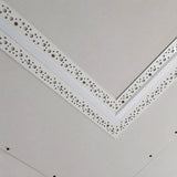 Straight plaster-in profile screwed into a plasterboard ceiling at a mitred corner before skimming