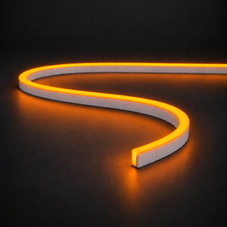 Golden 6x12mm 12V IP65 LED neon flex with a domed luminous top in an S-curve on dark charcoal.