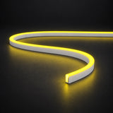 Lemon Yellow 6x12mm 12V IP65 LED neon flex with a domed luminous top in an S-curve on dark charcoal.