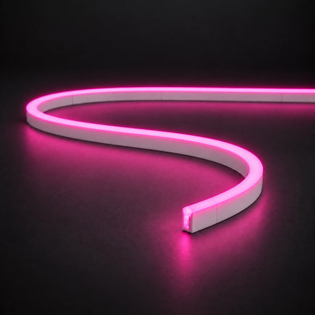 Pink 6x12mm 12V IP65 LED neon flex with a domed luminous top in an S-curve on dark charcoal.