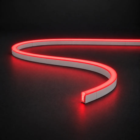Red 6x12mm 12V IP65 LED neon flex with a domed luminous top in an S-curve on dark charcoal.
