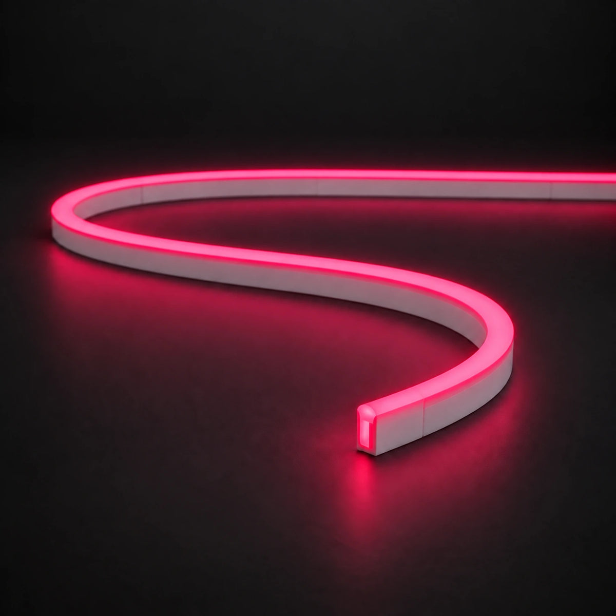 Rose Red 6x12mm 12V IP65 LED neon flex with a domed luminous top in an S-curve on dark charcoal.