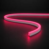 Rose Red 6x12mm 12V IP65 LED neon flex with a domed luminous top in an S-curve on dark charcoal.