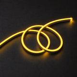 UK LED Lights golden 8×16mm 220–240V neon flex in a double-loop arrangement on dark charcoal