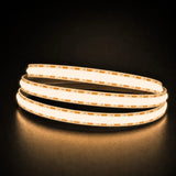 Warm White 3000K COB LED strip coil illuminated on a dark background, 24V DC and 10mm wide.